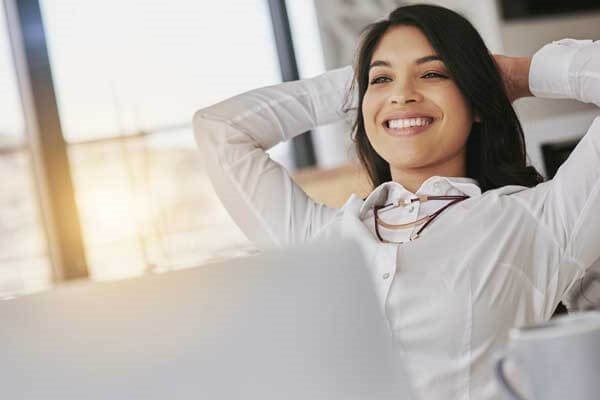 A lady relaxing at a computer