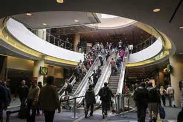 People bustling across a busy lobby